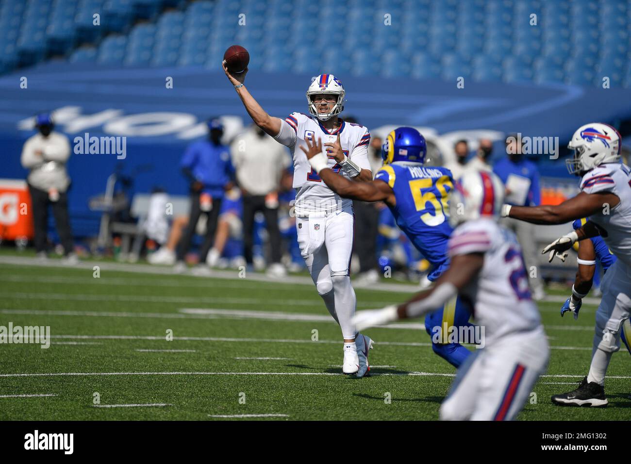 Buffalo Bills quarterback Josh Allen (17) hands off the ball to running  back Devin Singletary (26) during the first quarterof an NFL division round  football game, Sunday, Jan. 22, 2023, in Orchard