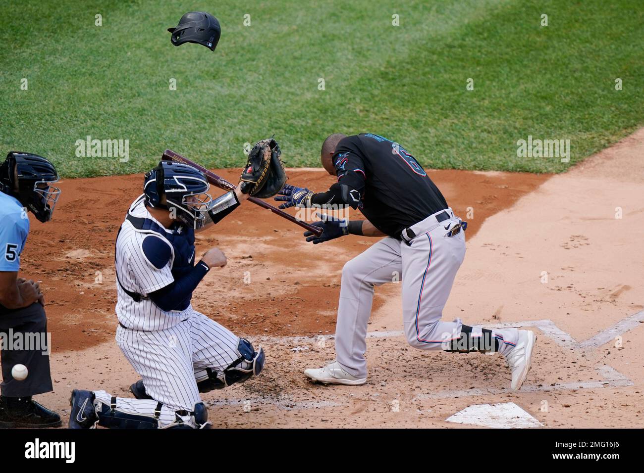 Miami Marlins' Starling Marte (6) ducks after being hit by a pitch that