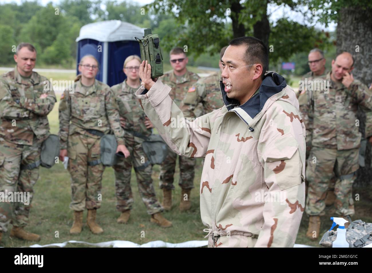 U.S. Army Capt. John Flegal, chemical, biological, radioactive and nuclear (CBRN) officer-in-charge, 37th Infantry Brigade Combat Team, briefs Soldiers following a CBRN training exercise at Camp Grayling, Michigan, Aug. 20, 2022. This training required Soldiers to be exposed to a mild and benign chemical irritant in order to build confidence in using their M50 Gas Mask. Stock Photo