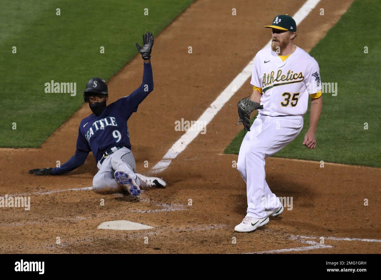 Seattle Mariners' Dee Strange-Gordon adjusts his batting helmet