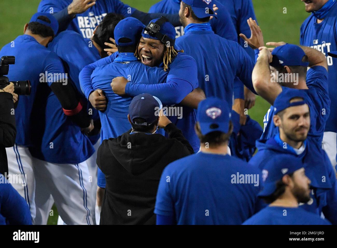 Toronto Blue Jays first baseman Vladimir Guerrero Jr., center, and  teammates celebrate a 4-1 win over the New York Yankees in a baseball game  in Buffalo, N.Y., Thursday, Sept. 24, 2020. Toronto