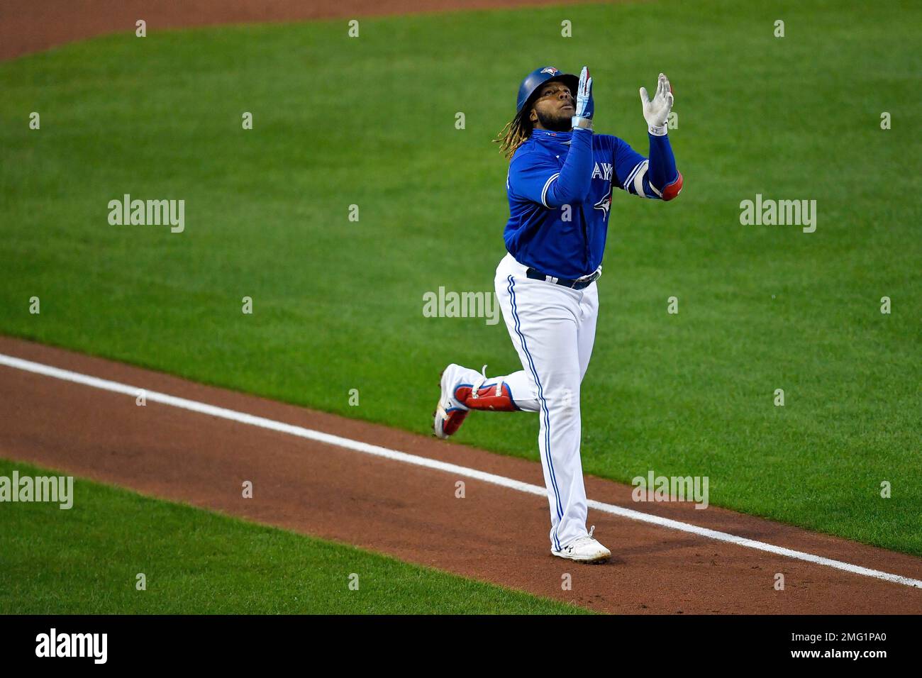 Toronto Blue Jays' Vladimir Guerrero Jr. celebrates as he heads for home  after hitting a solo home run against the New York Yankees during the  second inning of a baseball game in