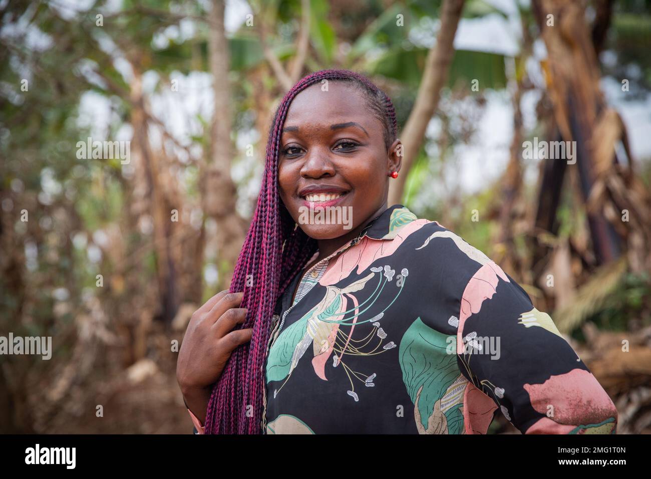 Portrait of an attractive young African woman smiling with braids Stock ...