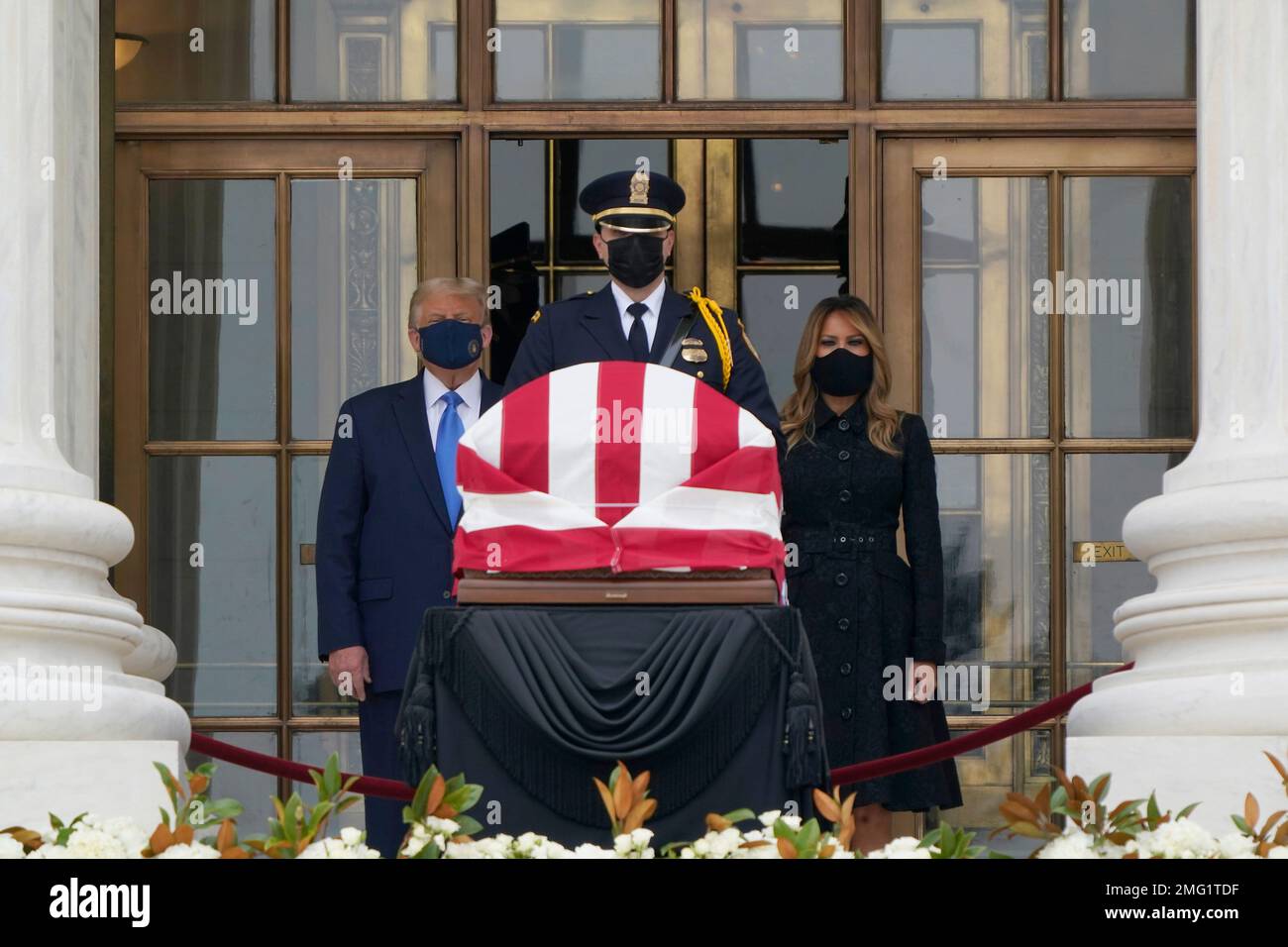 President Donald Trump and first lady Melania Trump pay respects as