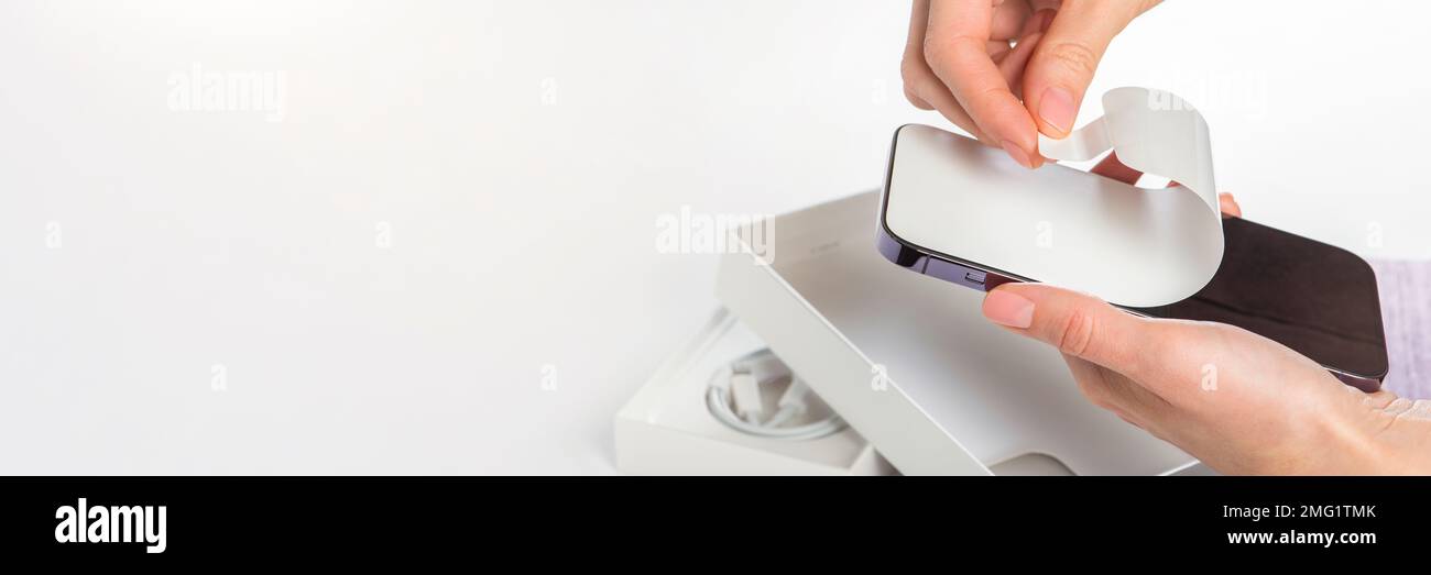 Unpacking a new phone. Remove the protective white film from the new