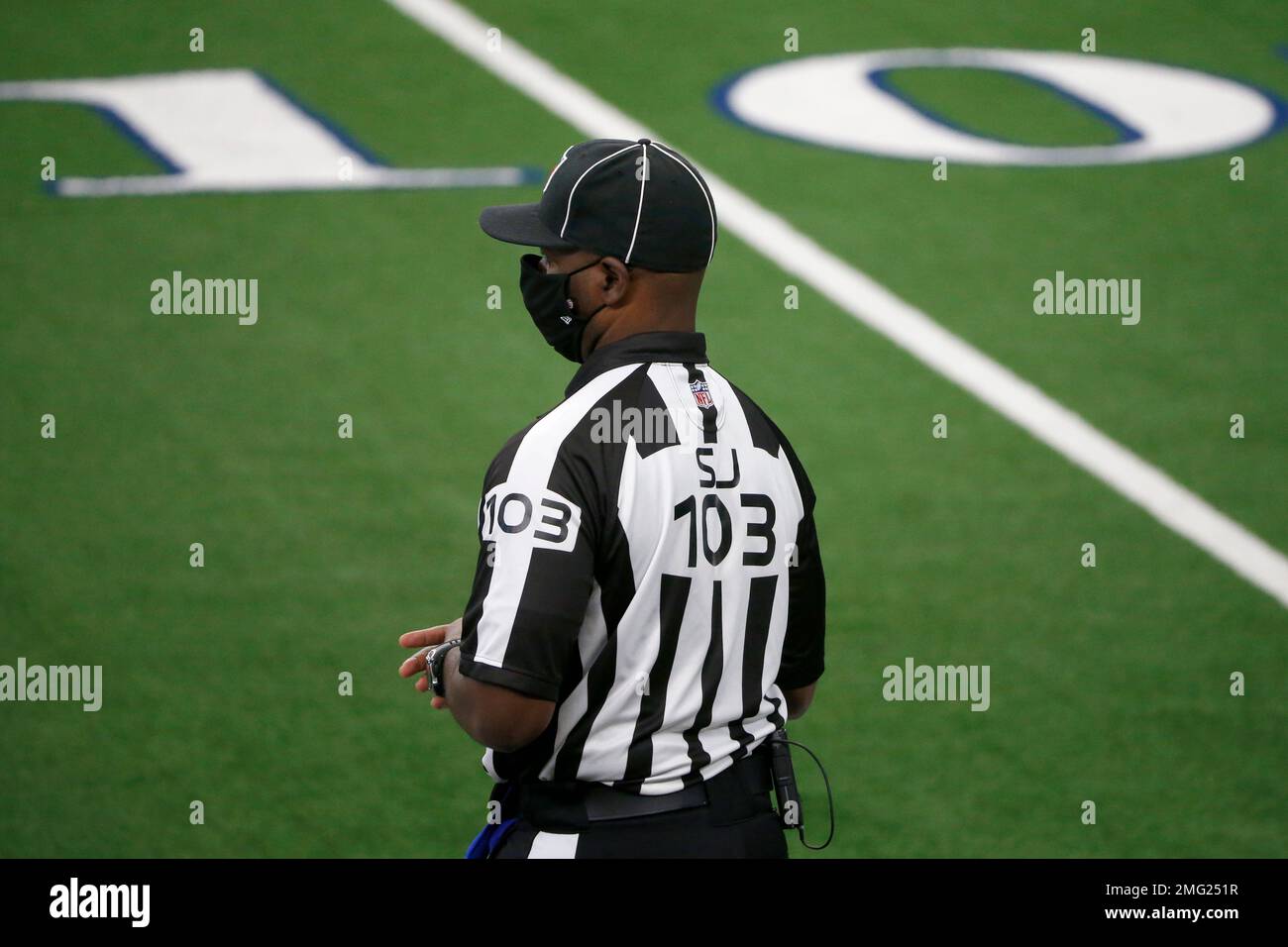 NFL side judge Eugene Hall watches pregame activities prior to an NFL