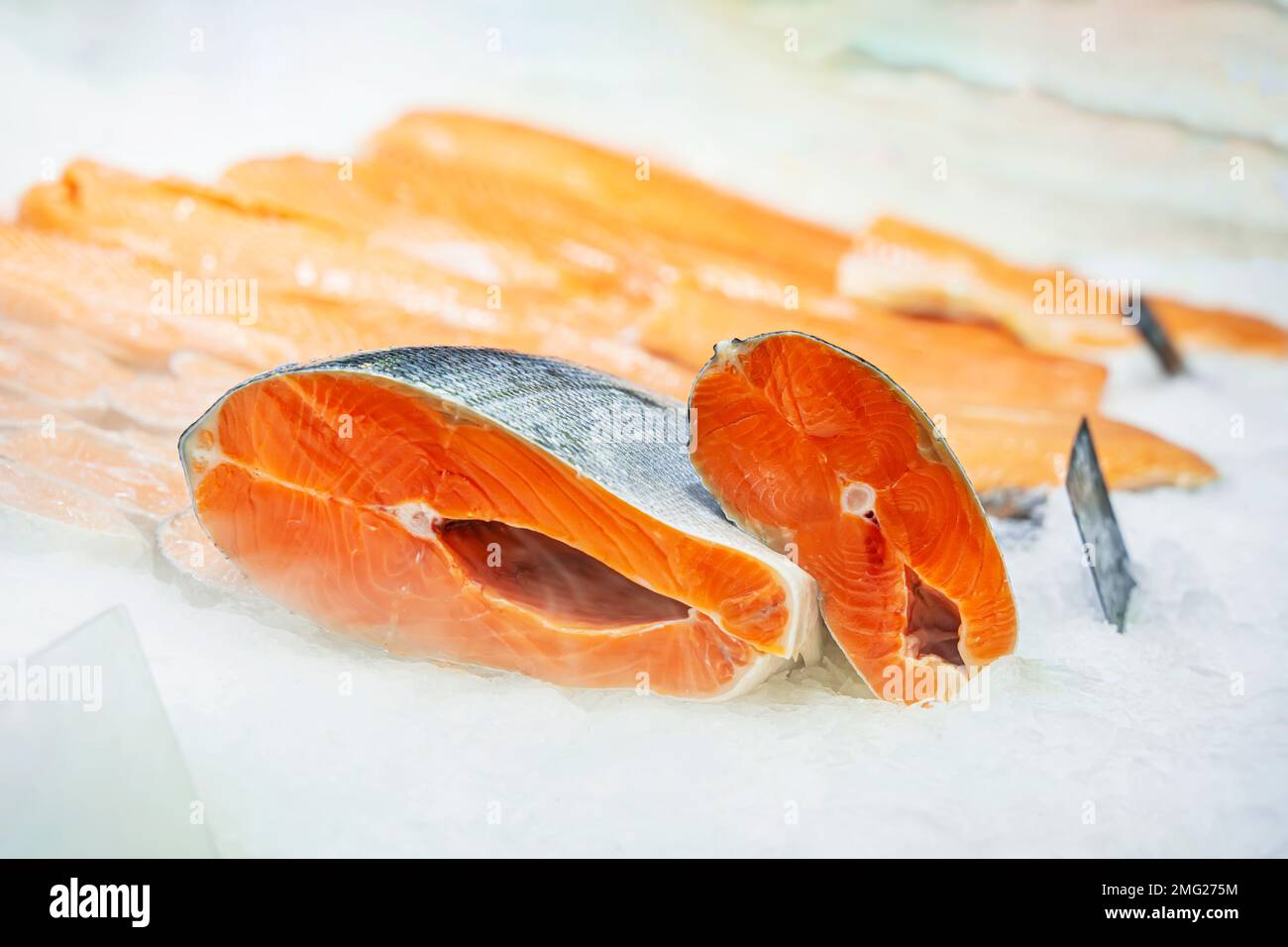 Fresh salmon steaks on ice for sale in supermarket close up. Healthy eating concept Stock Photo