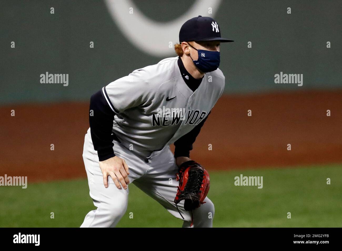 New York Yankees' Clint Frazier wears a mask while playing in left