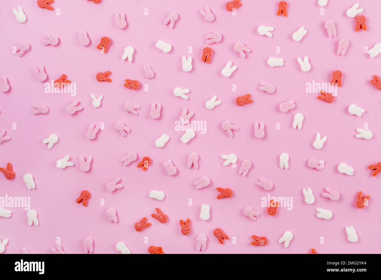 Easter pattern made of decoration with bunny ears sugar sprinkle top on ...