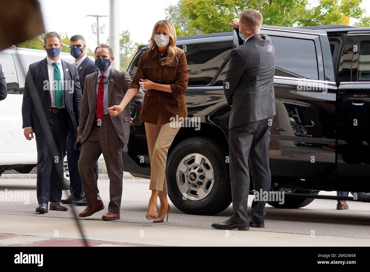 First lady Melania Trump adjust her sleeve as she stops for a visit at ...