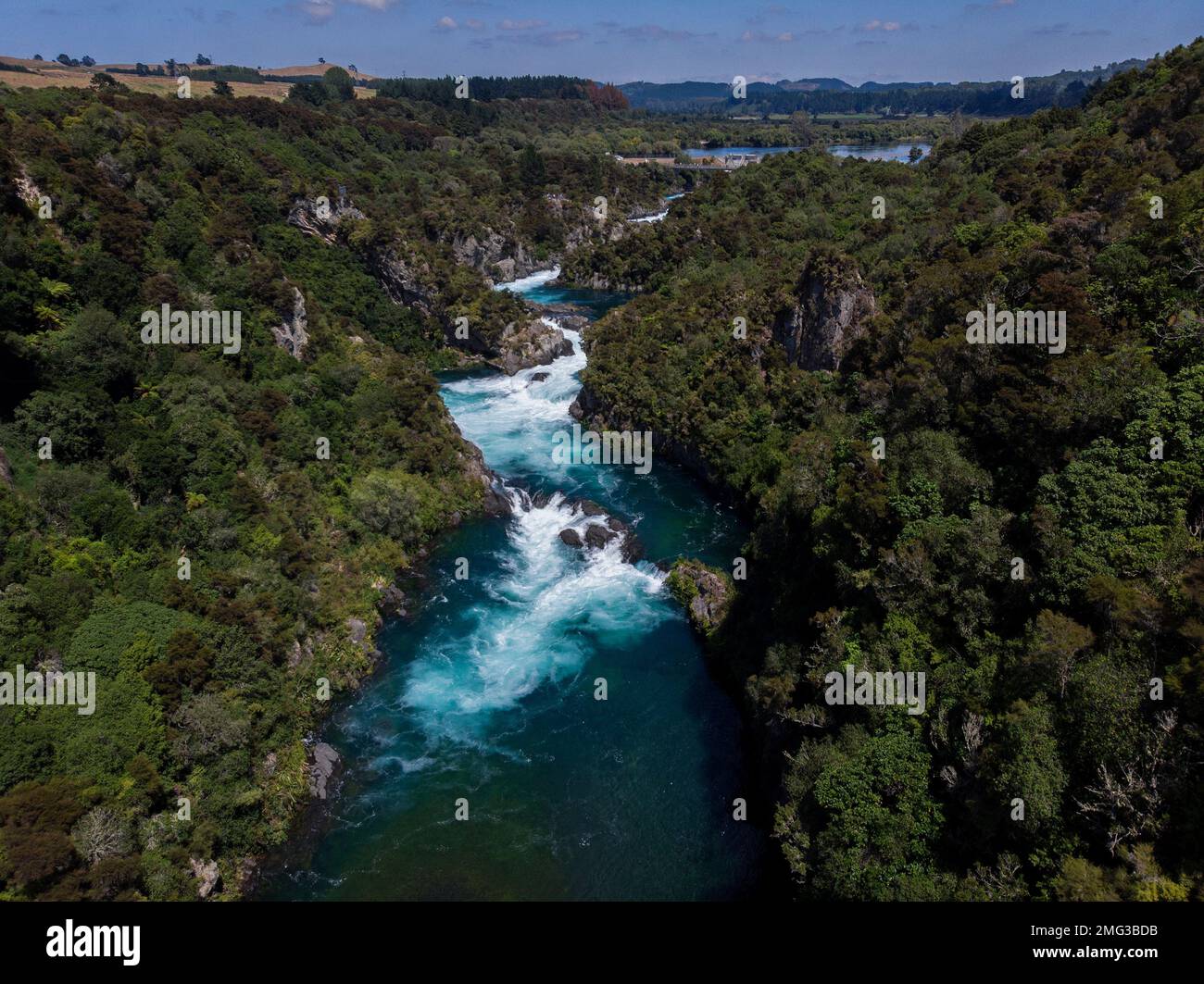 Aerial panorama of water flooded canyon Waikato river rapids surrounded by green nature forest at Aratiatia Dam near Lake Taupo North Island New Zeala Stock Photo