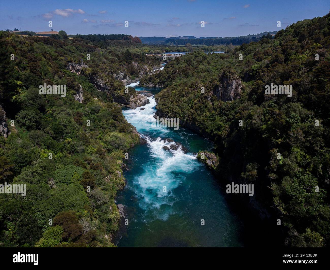 Aerial panorama of water flooded canyon Waikato river rapids surrounded by green nature forest at Aratiatia Dam near Lake Taupo North Island New Zeala Stock Photo