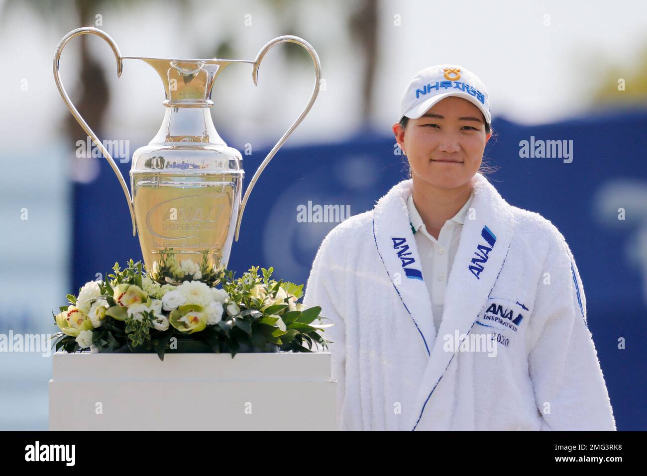 Mirim Lee of South Korea, poses the championship trophy after winning
