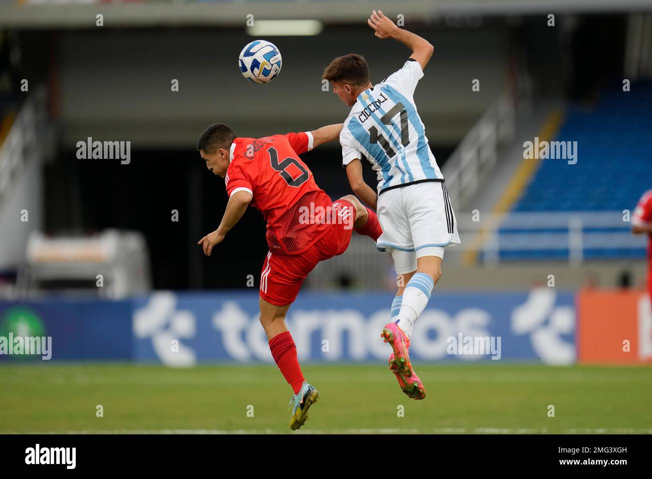 Peru's Jeffrey Cabellos, left, and Argentina's Ulises Ciccioli jump for