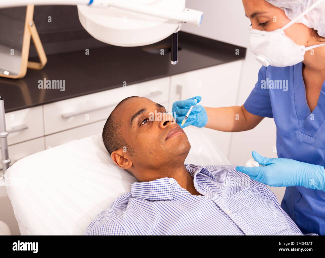 Man getting injections face hi-res stock photography and images - Alamy