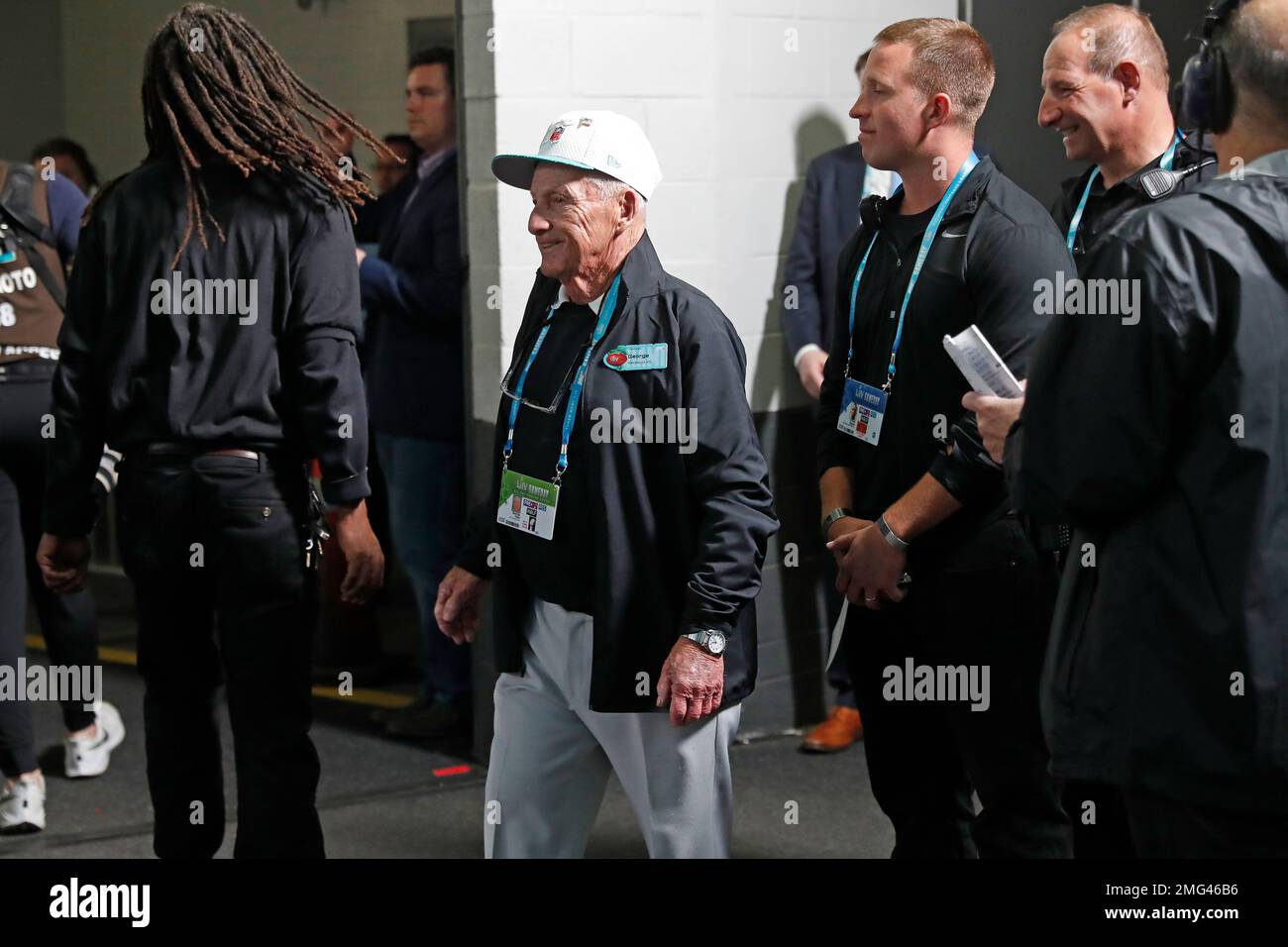 NFL groundskeeper Toma walks onto the field before the NFL Super