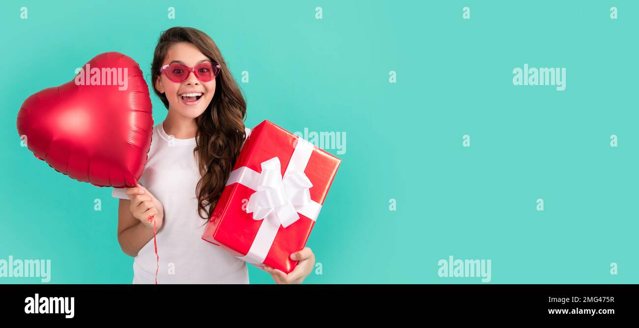 valentine day. shopping final sell out. teenage shopper. stylish teen girl in sunglasses. Kid girl with gift, horizontal poster. Banner header with Stock Photo