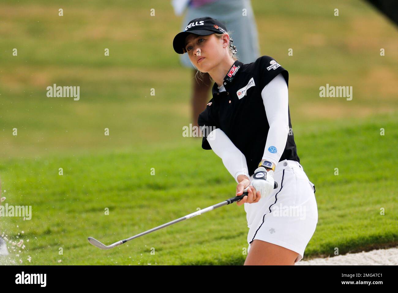 Nelly Korda hits out of a bunker on the second hole during the third