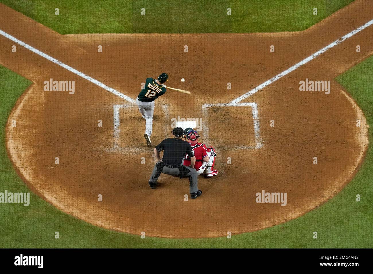 Oakland Athletics' Sean Murphy connects for a single to center as Texas
