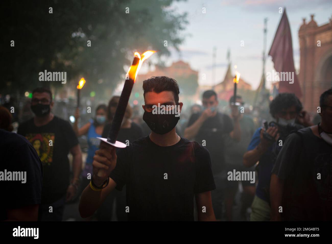 Pro-independent supporters, some of them holding torches, march during the  Catalan National Day in Barcelona, Spain, Friday, Sept. 11, 2020. Thousands  of Catalans who support secession from the rest of Spain have