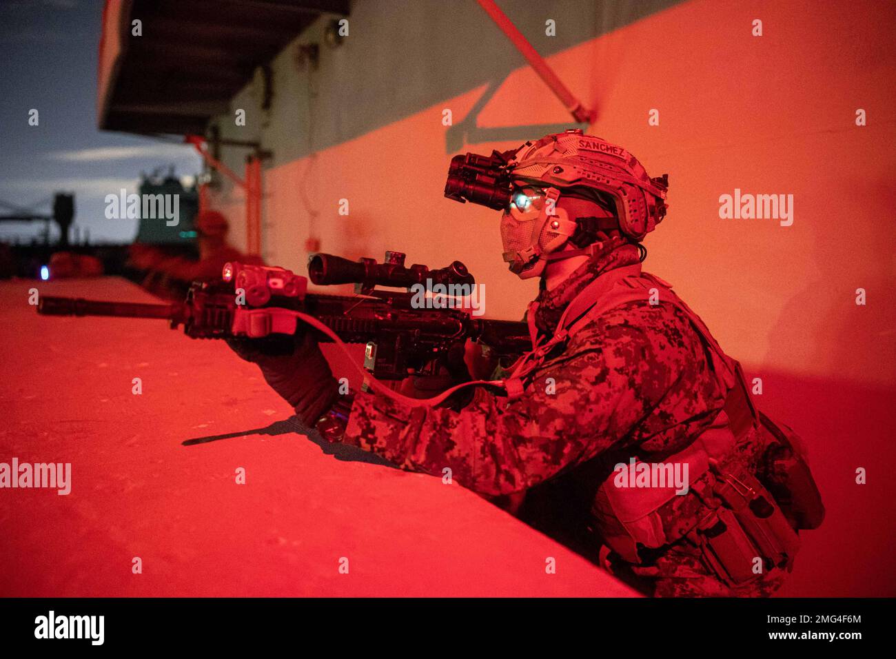 Fort Eustis, Virginia, USA. 13th Jan, 2023. U.S. Marine Corps Pfc. Nelson Sanchez, an Orlando, Florida native and a designated marksman with Battalion Landing Team 1/6, 26th Marine Expeditionary Unit (MEU) establishes security during a Visit, Board, Search and Seizure (VBSS) course at Fort Eustis, Virginia, January. 13, 2023. The VBSS course is designed by Expeditionary Operations Training Group to train MSPF, BLT 1/6, and supporting enablers across the Marine Air Ground Task Force to conduct Maritime Interception Operations in preparation for the Amphibious Ready Group/Marine Expeditionar Stock Photo