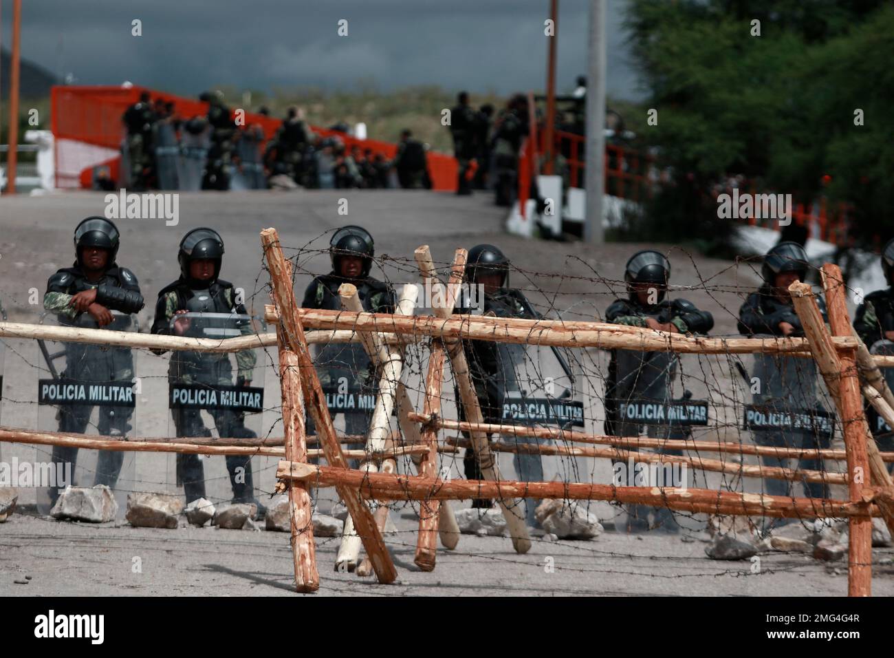 National Guard troops equipped with riot gear stand guard at Las Pilas dam,  two days after withdrawing from nearby La Boquilla dam in clashes with  hundreds of farmers, in Camargo, Chihuahua State