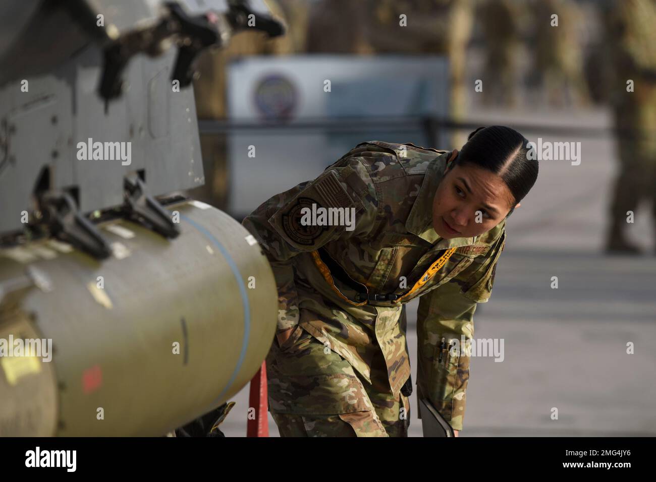 Nellis, Nevada, USA. 13th Jan, 2023. U.S. Air Force Staff Sgt. Victoria Castro, serving as an evaluator for the 57th Maintenance Group, checks the load crews work during Load Crew of the Year competition at Nellis Air Force Base, Nevada, January. 13, 2022. These competitions help ensure mission readiness and elevate unit morale. (photo by Cydnie Williams.) (Credit Image: © U.S. Air Force/ZUMA Press Wire Service) EDITORIAL USAGE ONLY! Not for Commercial USAGE! Stock Photo