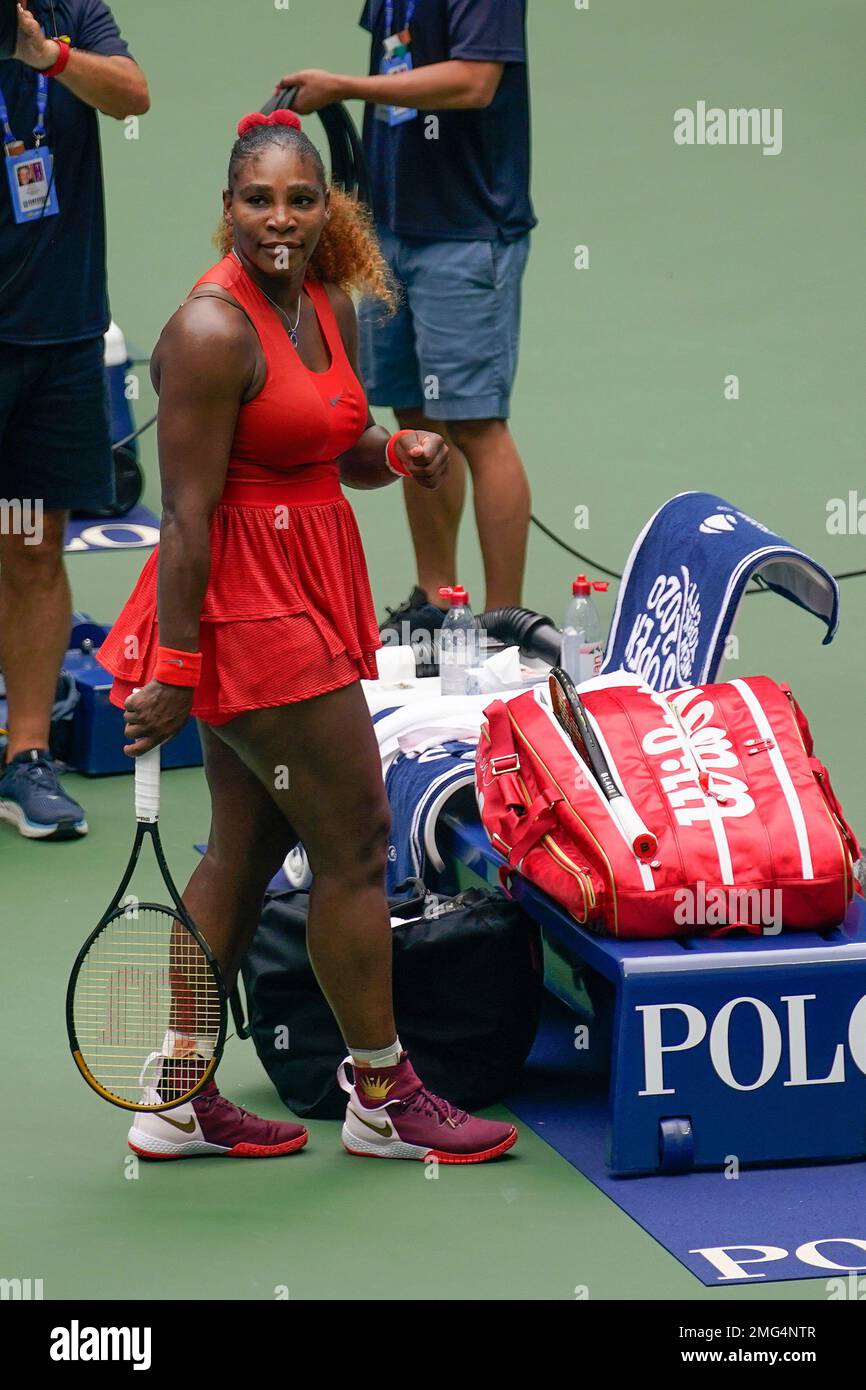 Serena Williams, of the United States, looks back at her coaching box