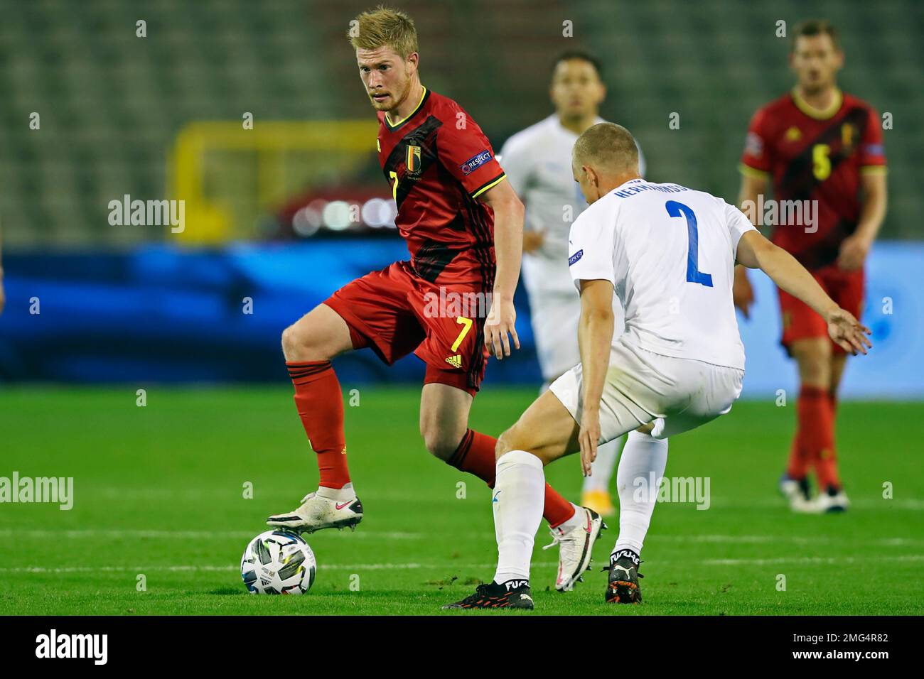 Belgium's Kevin De Bruyne, left, vies for the ball with Iceland's