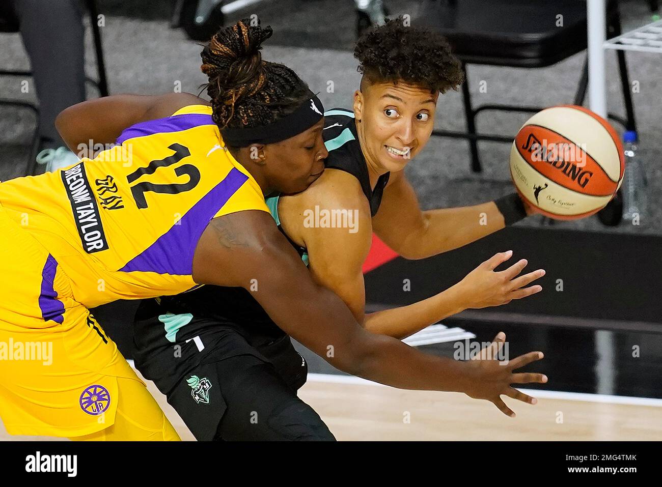 Los Angeles Sparks guard Chelsea Gray (12) ties up New York Liberty