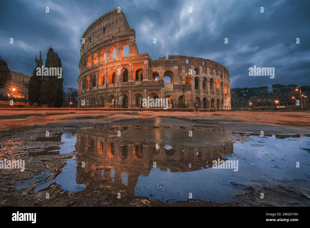 Colosseum at sunrise in Rome, Italy, Europe. Rome ancient arena of gladiator fights. Rome Colosseum is the best known landmark of Rome and Italy Stock Photo