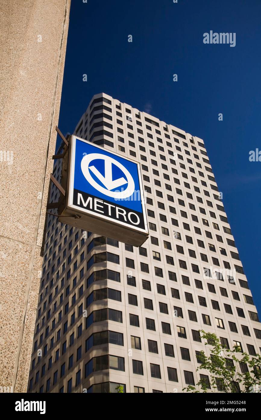 Montreal subway station entrance sign attached to side of building in ...