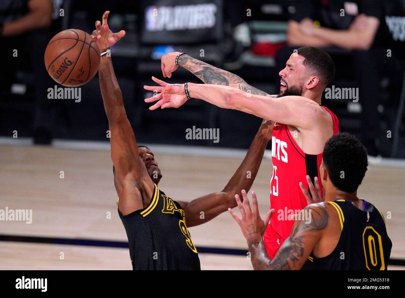 Houston Rockets' Austin Rivers (25) blocks a shot by Los Angeles Lakers ...