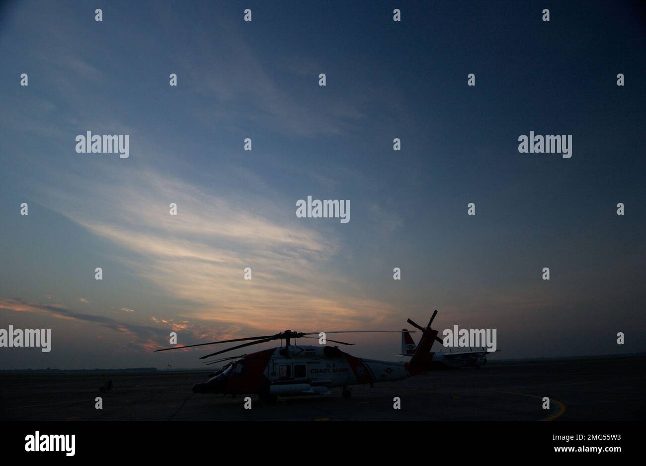 Aircrafts - HH-60 Jayhawk - 26-HK-53-80. HH-60 on flight line at sunrise-sunset6. Hurricane Katrina Stock Photo