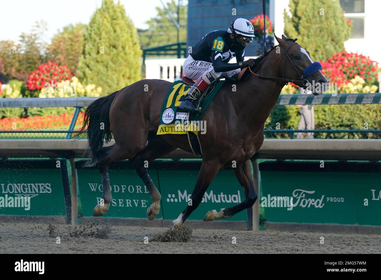 Jockey John Velazquez riding Authentic gallops to the finish line to