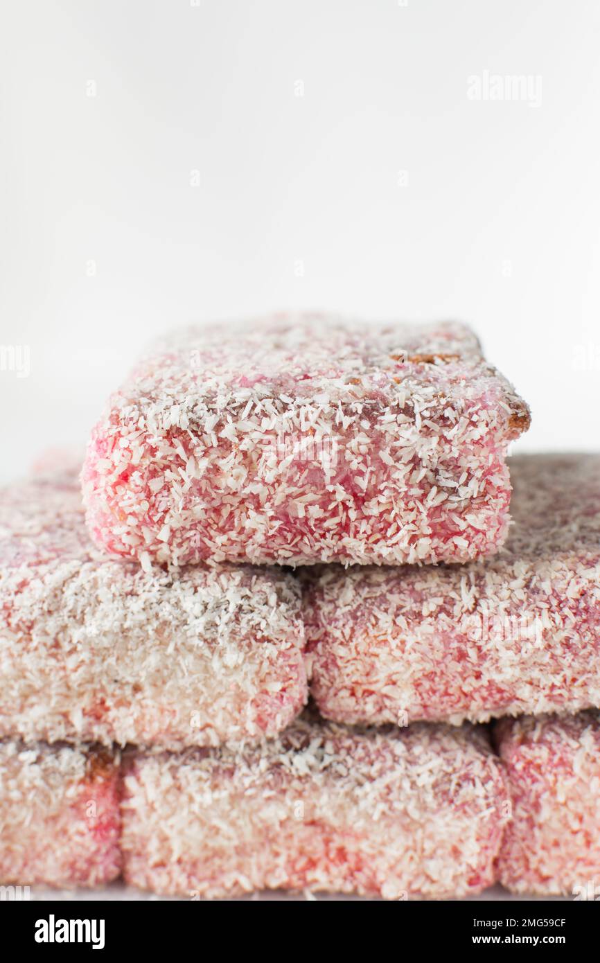 Pink lamingtons on a marble tray, Australian raspberry lamingtons, cake