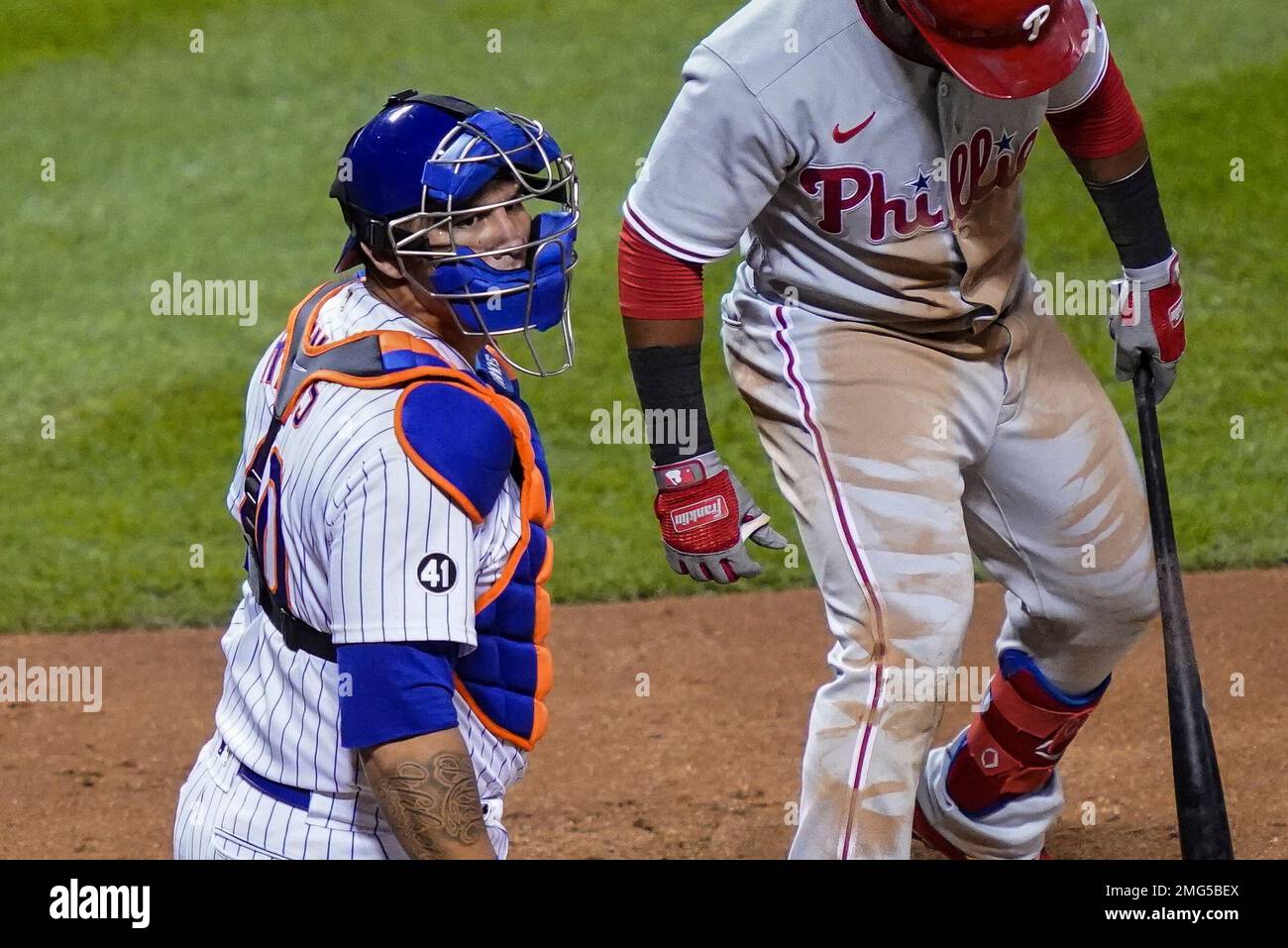 New York Mets catcher Wilson Ramos, left, wears a No. 41 sleeve patch in  honor of the late Tom Seaver, during the third inning of the team's  baseball game against the Philadelphia