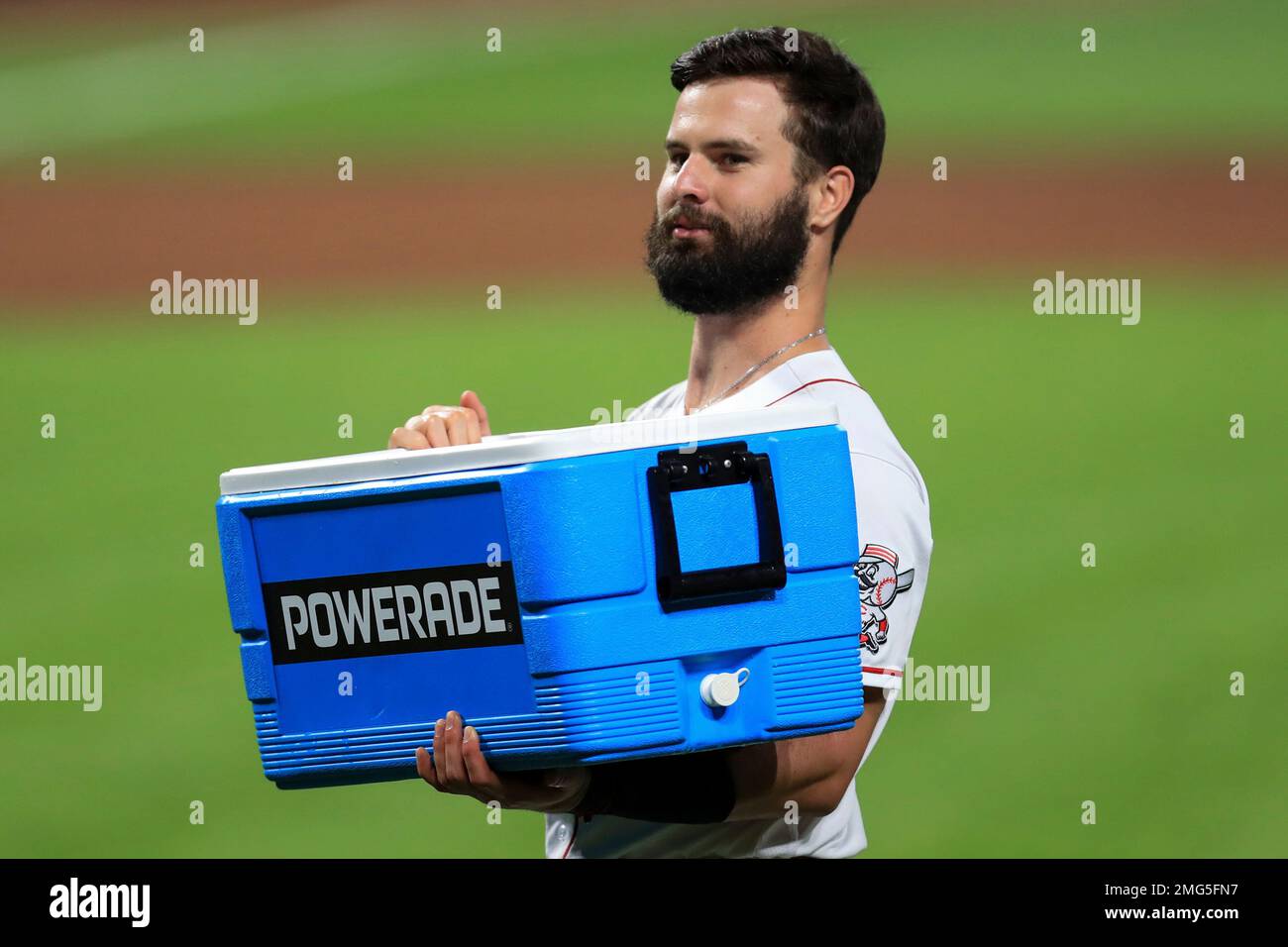 Cincinnati Reds' Jesse Winker carries a Powerade cooler after a baseball  game against the St. Louis Cardinals in Cincinnati, Wednesday, Sep. 2,  2020. The Reds won 4-3. (AP Photo/Aaron Doster Stock Photo - Alamy