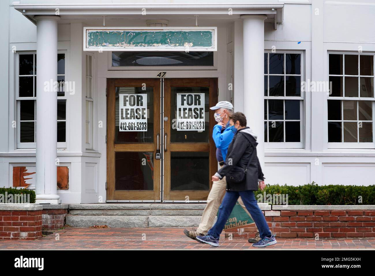 CORRECTS DATE - Shoppers pass by a former Clark's shoe store that is now  one of several vacant retail spaces among the outlet shops in Freeport,  Maine, Wednesday, Sept. 2, 2020. U.S.