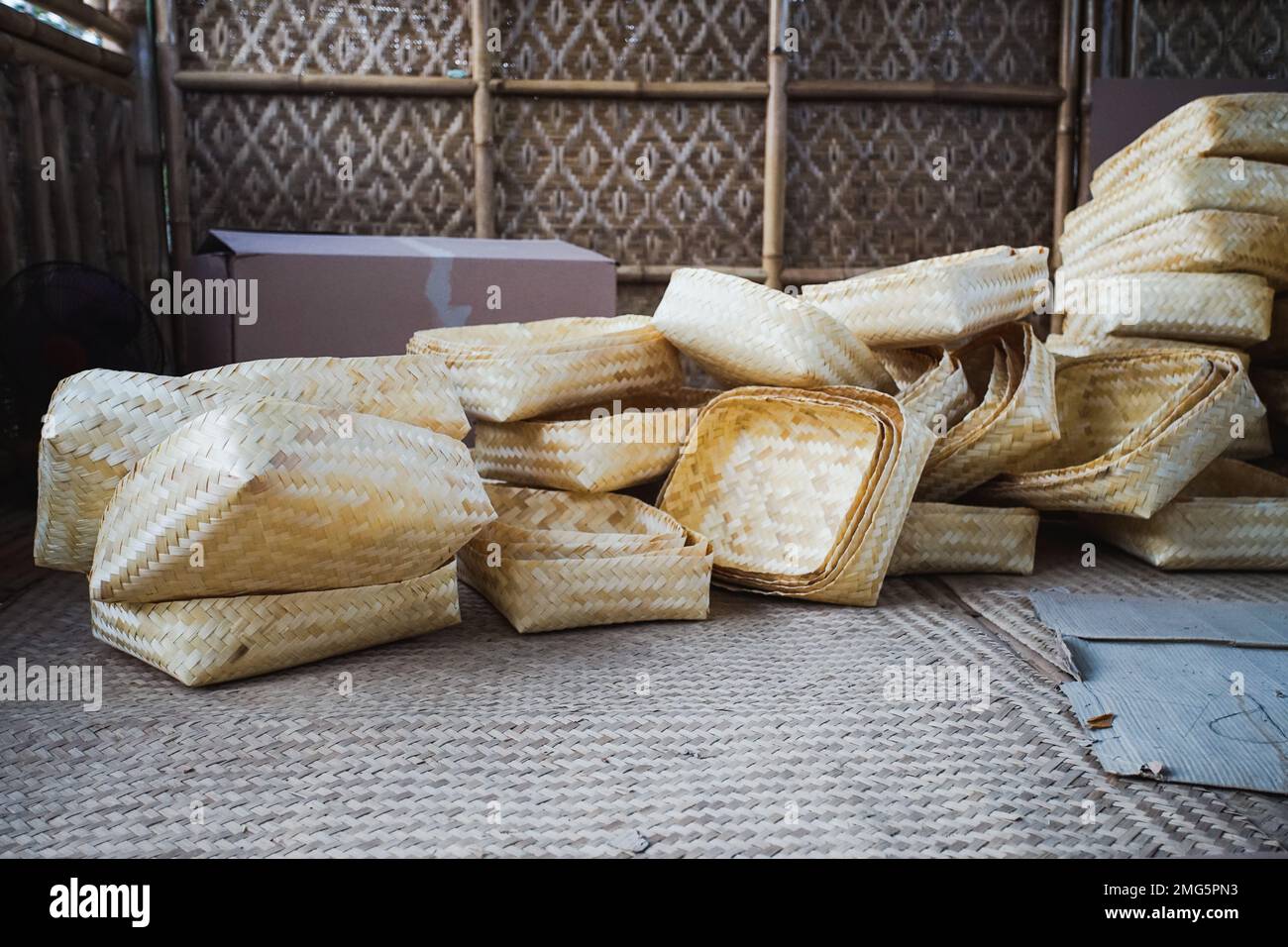 Traditional bamboo woven boxes called Besek in a warehouse at Brajan Bamboo Handicraft village, Yogyakarta, Indonesia ready to be exported abroad. Stock Photo