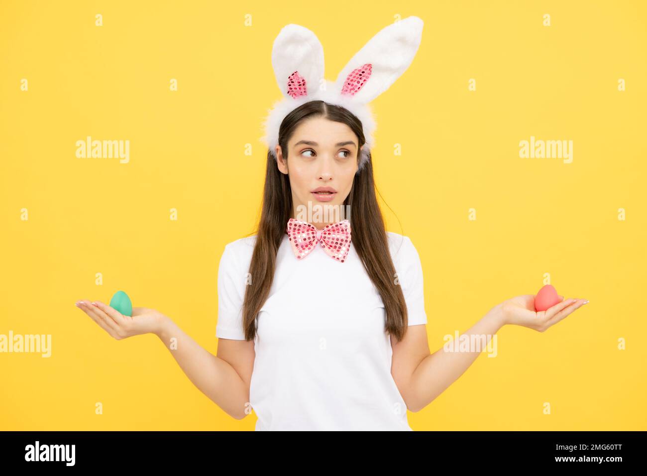 Easter eggs hunt. Attractive cheerful smiling girl in bunny ears