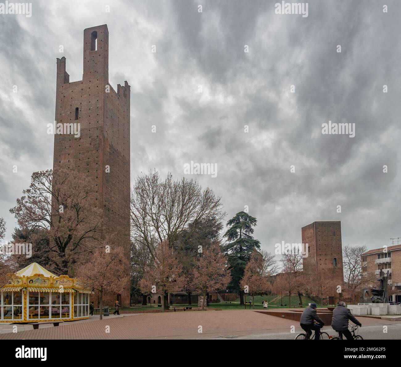 The winter face of Rovigo downtown. The medieval towers in piazza Matteotti against a cloudy sky. Rovigo, Veneto, Italy. Stock Photo