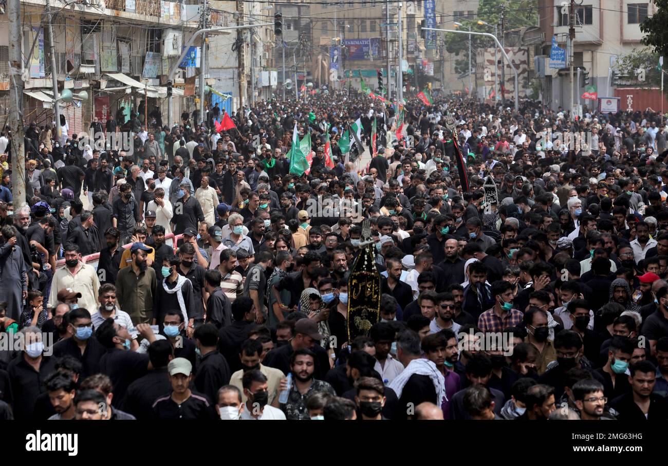 Shiite Muslims participate in a procession marking Ashoura, in Karachi ...