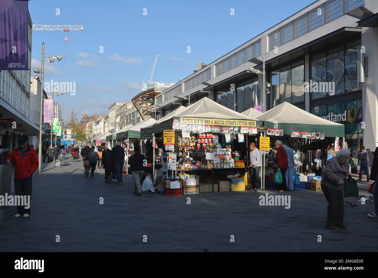 Shoppers walking along the Moor in Sheffield city centre, England UK. Open air Market stalls Stock Photo