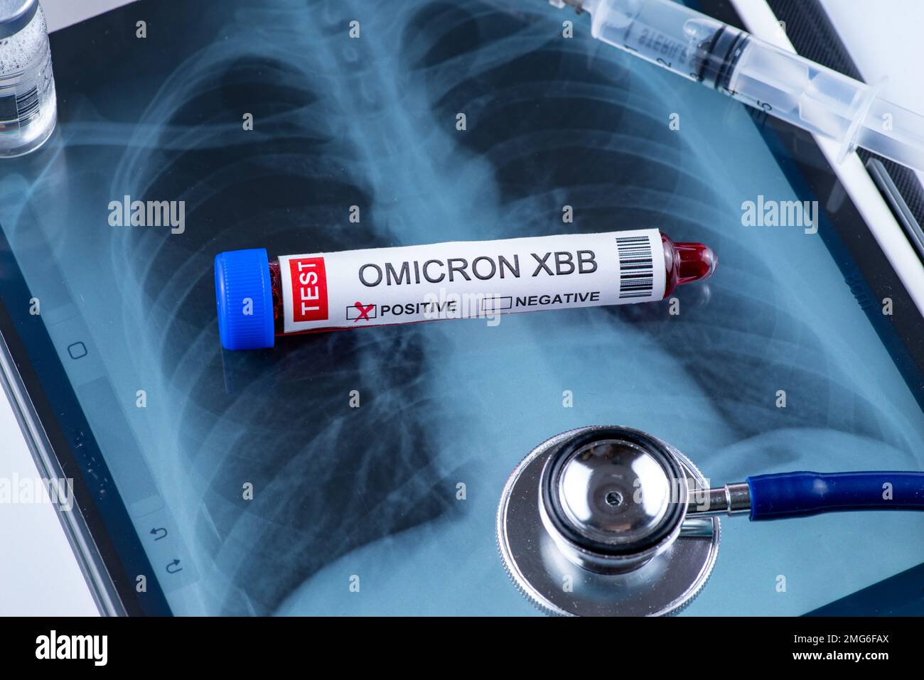 Test tube labelled 'OMICRON XBB variant test positive' Stock Photo