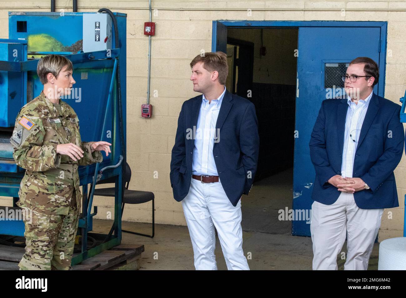 Robby Wehagen, House of Representatives deputy chief of staff and legislative director, talks to CW4 Natasha Ryan, an aviation safety officer assigned to 603rd Aviation Support Battalion, during a hangar tour at Hunter Army Airfield, August 22, 2022. Wehagen toured the airfield to learn about upcoming projects and to discuss the conditions of aircraft hangars. Stock Photo