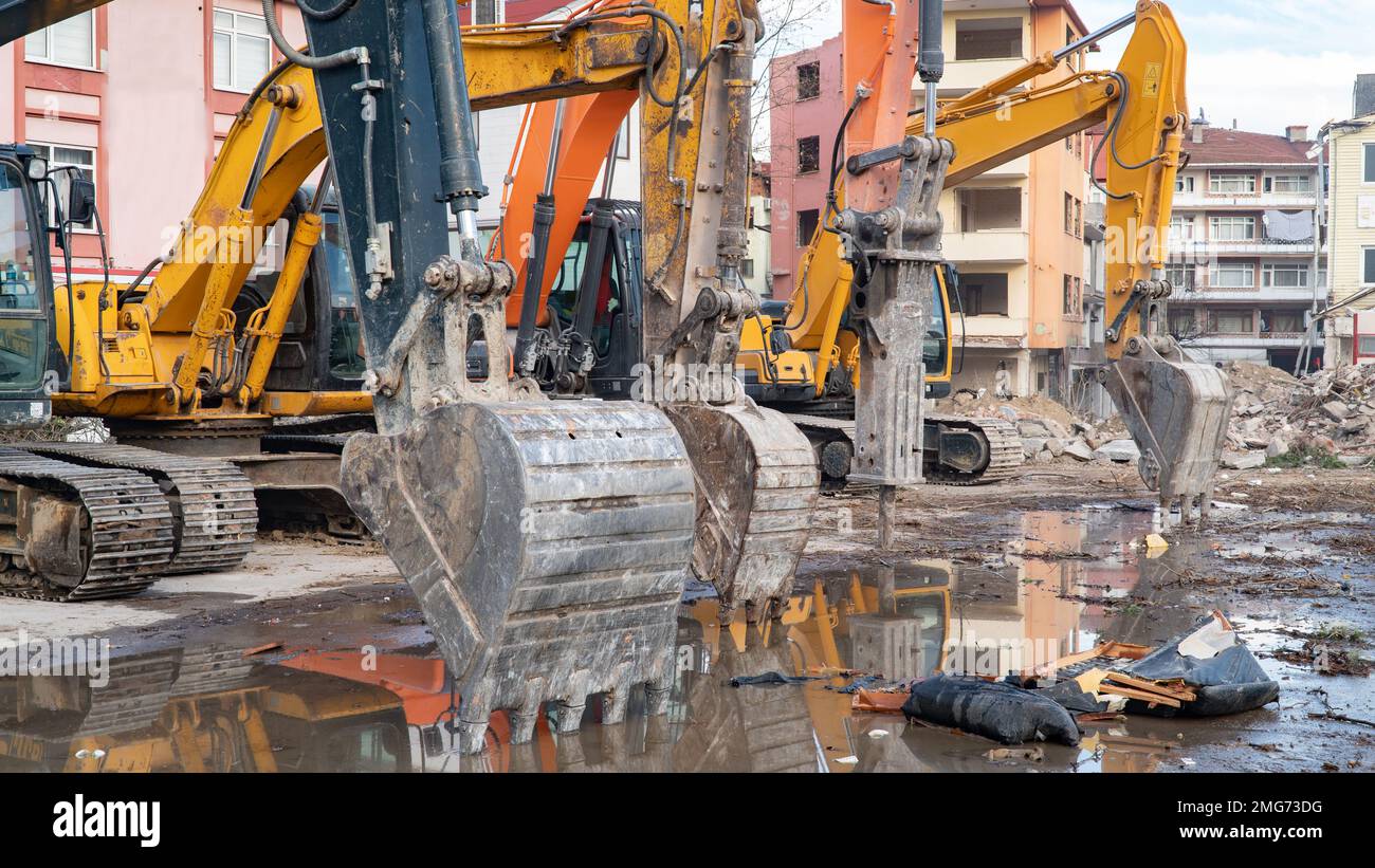 Construction machinery in construction site. Excavator and other heavy machineries. Stock Photo