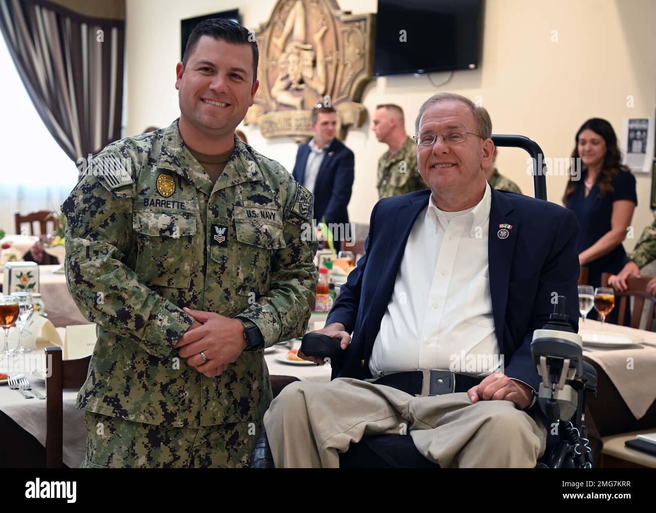 220822-N-OX321-1133 NAVAL AIR STATION SIGONELLA, Italy (Aug. 22, 2022)-- U.S. Rep. Jim Langevin (D-RI), right, takes a photo with Master-at-Arms 1st Class Stephen Barrette, from Woonsocket, Rhode Island, before lunch at the Ristorante Bella Etna galley during the House Armed Services Committee delegation visit to Naval Air Station Sigonella, Aug. 22, 2022. NAS Sigonella’s strategic location enables U.S., allied, and partner nation forces to deploy and respond as required to ensure security and stability in Europe, Africa and Central Command. Stock Photo
