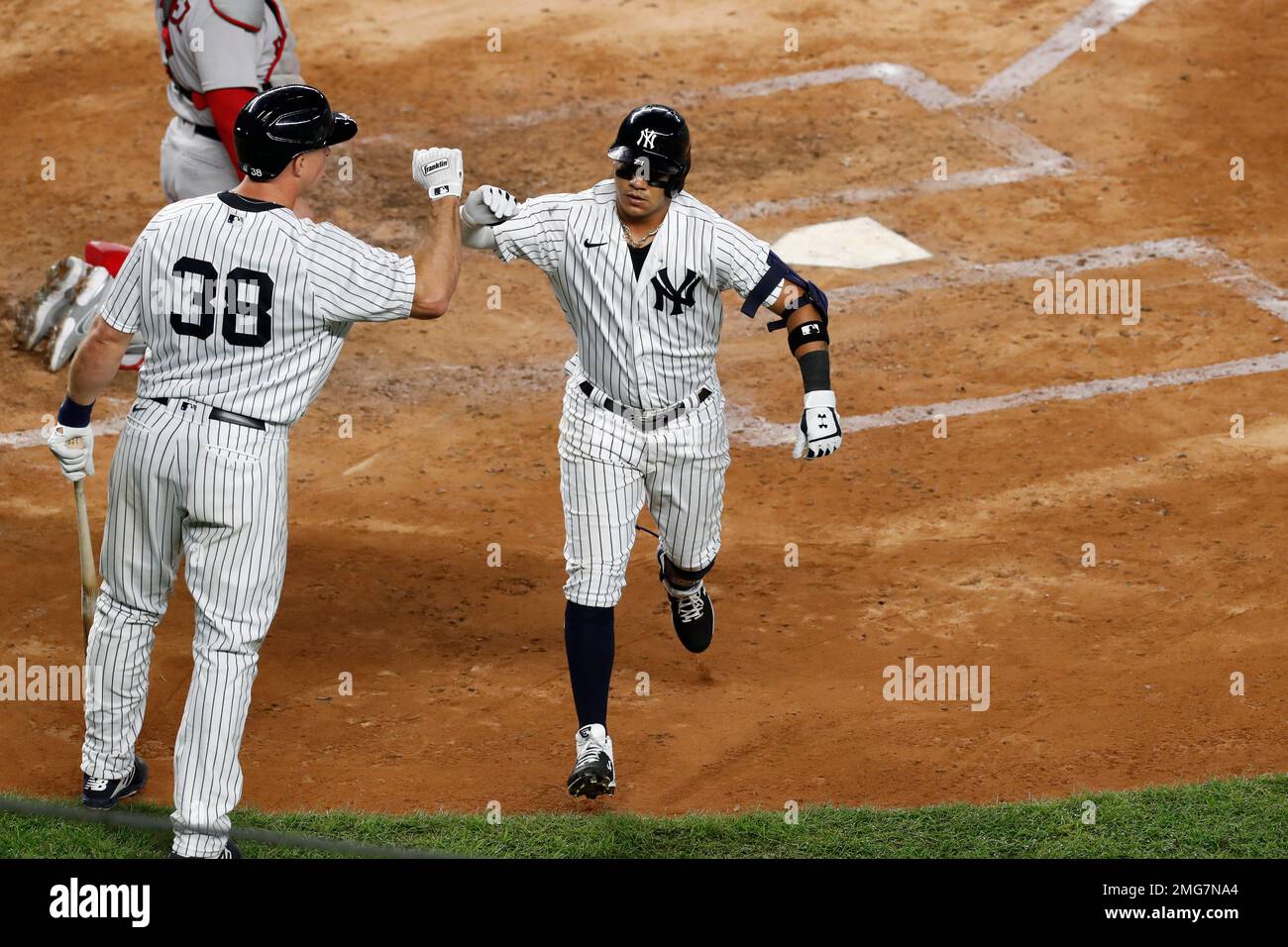 New York Yankees on-deck batter Erik Kratz (38) celebrates with teammate  Thairo Estrada, right, after Estrada hit a solo home run during the fourth  inning of a baseball game, Monday, Aug. 17