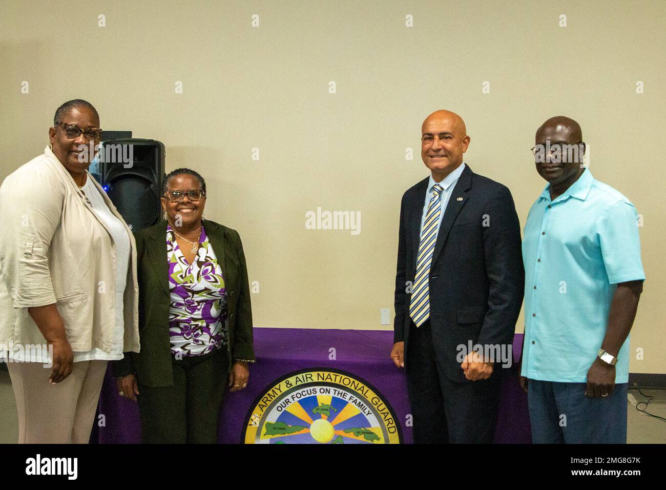 (l-r) Ms. Lorelle Clarke, Ms. Linda Todman, Mr. Angel Diaz, and Mr. Beresford Edwards pose for a photo during the V.I. National Guard State Family Program Office presentation of the 2021 National Guard Family Program Community Purple Award, Monday, August 22, 2022.     In a small ceremony held at the Joint Force Headquarters facility, Mr. Angel E. Diaz Jr., veteran, and co-owner of the La Reine Chicken Shack, was awarded the Family Program Community Purple Award, which is awarded to organizations or businesses that exemplifies the true meaning of the purple concept within the National Family P Stock Photo